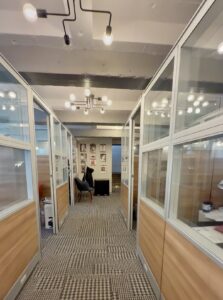 Rows of well-lit private cubicles